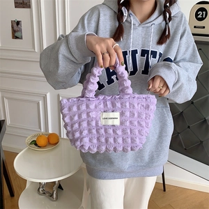 Detail of purple bubble texture canvas handbag with LOVE SOZAKKA woven label