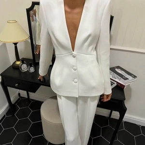 Elegant white two-piece suit set featuring a V-neck blazer and straight-leg trousers for women