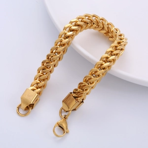 Men's hip hop 8mm golden franco chain bracelet with large lobster clasp on white ceramic