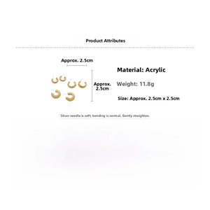 Detail showing acrylic C-shaped earrings with gold texture and product dimensions