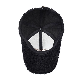 Black sherpa fleece baseball cap with internal stitching and metal adjustment buckle