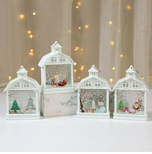 Detail of four white Christmas house lanterns with Santa, snowman and deer patterns