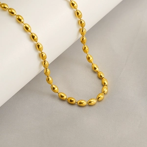 Polished gold stainless steel oval bead necklace with minimalist aesthetic for women