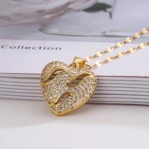 Elegant gold hollow heart pendant necklace with shimmering cubic zirconia stones