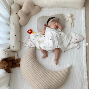 Quilted cotton baby bedding set with cloud and moon plush pillows in warm beige