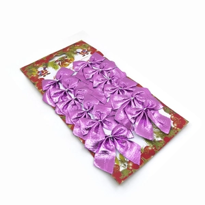 Set of 12 metallic purple Christmas tree bow decorations on festive cardboard backing