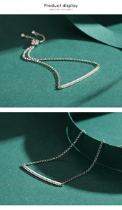Macro detail of silver S925 sterling bracelet with pavé cubic zirconia curved bar