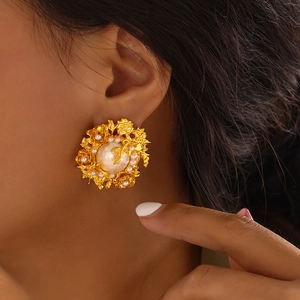 Vintage gold baroque pearl flower earrings featuring tiered petals and an ornate floral design