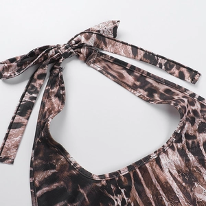 Close-up of leopard print halter neck tie with detailed stitching on stretch fabric