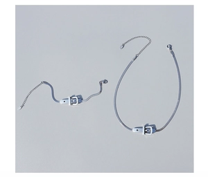 Macro detail of 925 sterling silver belt buckle style necklace and bracelet set
