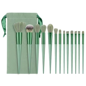 Professional 13-piece green makeup brush set with storage bag on white background