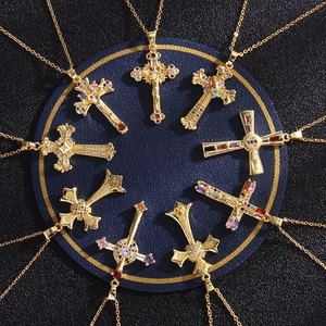 Golden cross necklaces with colorful zircon stones arranged in a radial display