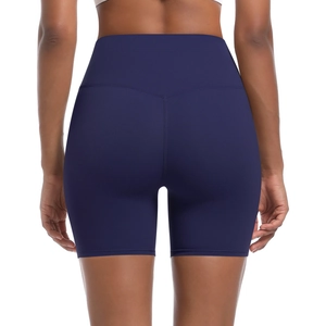 Detail of high-waisted navy blue yoga shorts with V-shaped stitching for a lifting effect