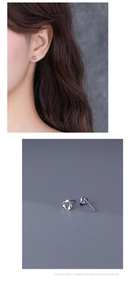 Close-up of minimalist silver hoop earrings and lifestyle model photo display