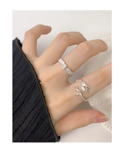 Close-up of S925 sterling silver branch and leaf open ring worn on female finger