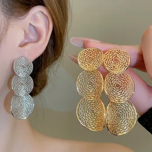 Three-layer hollow geometric circle drop earrings with fine textured metallic finish
