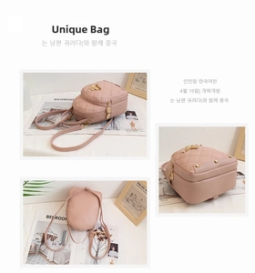 Detail view of pink quilted mini backpack with gold hardware from multiple side angles