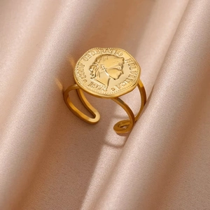 Detail of 18K gold stainless steel open ring featuring a vintage coin portrait design