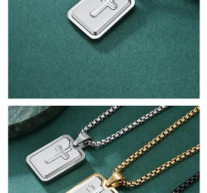 Detailed view of rectangular cross pendants in silver, gold, and black finishes on green stone