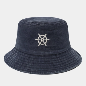 Close-up of anchor embroidery on navy washed cotton bucket hat with stitching detail