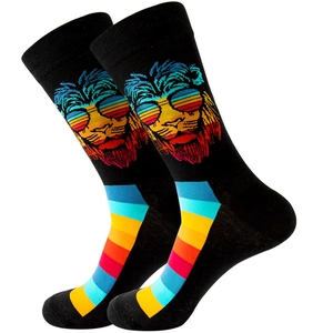 Black crew socks with colorful sunglass-wearing lion and rainbow stripes on white background