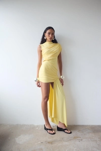 Detail of yellow sleeveless one-shoulder ruched dress with irregular hem and fabric texture