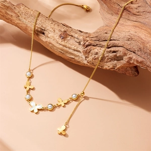 Golden stainless steel necklace featuring butterfly pendants and round pearl accents
