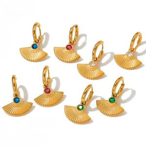 Detailed macro view of French style gold fan-shaped earrings with colorful zircon stones