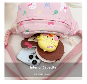 Internal capacity of kids pink waist bag showing phone, earphones and mirror storage
