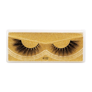 Macro detail of dense 3D faux mink eyelashes style #102 in transparent gold glitter box