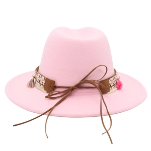 Detail of pink wool felt jazz hat with ethnic braided band and colorful tassels
