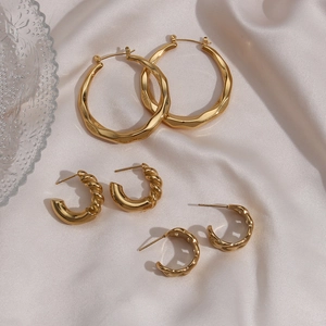Three-pair gold stainless steel earring set featuring twisted hoops and C-shaped studs