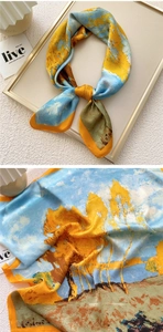 Detailed view of silk square scarf featuring oil painting landscape print and satin texture