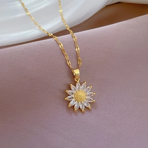 Luxurious gold sunflower pendant necklace with sparkling cubic zirconia on a fine chain