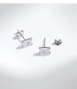 Close-up of S925 silver stud earrings featuring emerald cut clear cubic zirconia stones