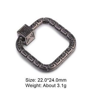 Macro shot of 22mm square copper pendant with Greek key pattern and grey zircon inlay