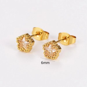Detail shot of 6mm gold star stud earrings with zircon inlay and beaded edge design