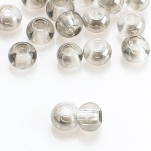 Close-up of translucent smoke gray glass beads for DIY jewelry and crystal hair accessories