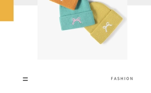Detailed view of colorful ribbed knit beanies with embroidered bow ties in multiple shades