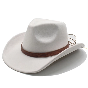 Detail of western cowboy wool fedora featuring a patterned brown leather band on beige felt
