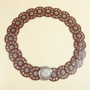 Vintage western brown leather waist belt with silver concho sunburst patterns for women