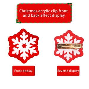 Detail view showing front and back of acrylic Christmas snowflake hair clip with gold metal grip