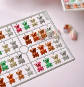 Macro detail of colorful mini resin bear charms for creative nail art decoration