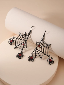 Detail of gothic spider web earrings with red rhinestones for Halloween costume accessories