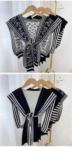 Detail of knitted fake collar with paisley pattern and stripe design in black and white