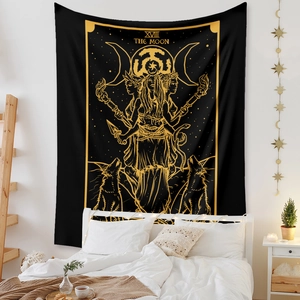 Detail of The Moon tarot tapestry with gold sun and snake patterns on a black background