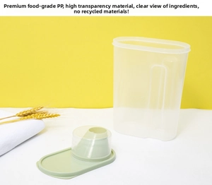 Macro detail of a transparent grain container with a green measuring cup lid for food storage