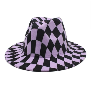Detail shot of purple and black checkered fedora hat featuring soft wool felt texture
