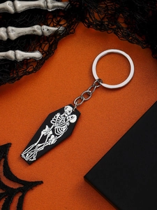 Halloween keychain with black coffin pendant showing hugging skeletons on orange background