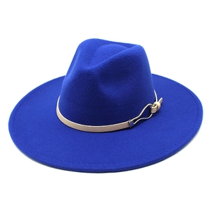 Detail of royal blue wide brim wool fedora with beige leather band and silver buckle